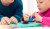 Therapy Assistant & Young Girl Play Dough